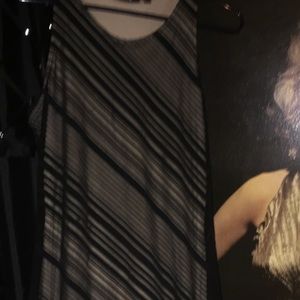 Maxi dress sheer black overlays tan midi length.