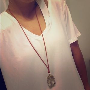 Orange necklace w/ crystal stone.