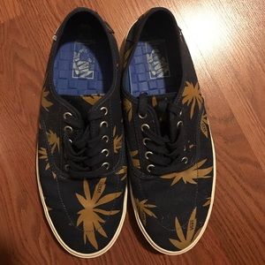 Men's blue Vans with yellow palm trees