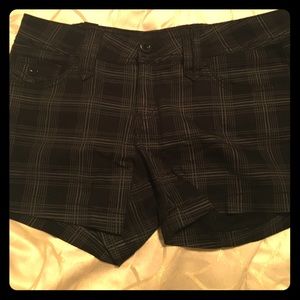 Plaid black and white shorts.