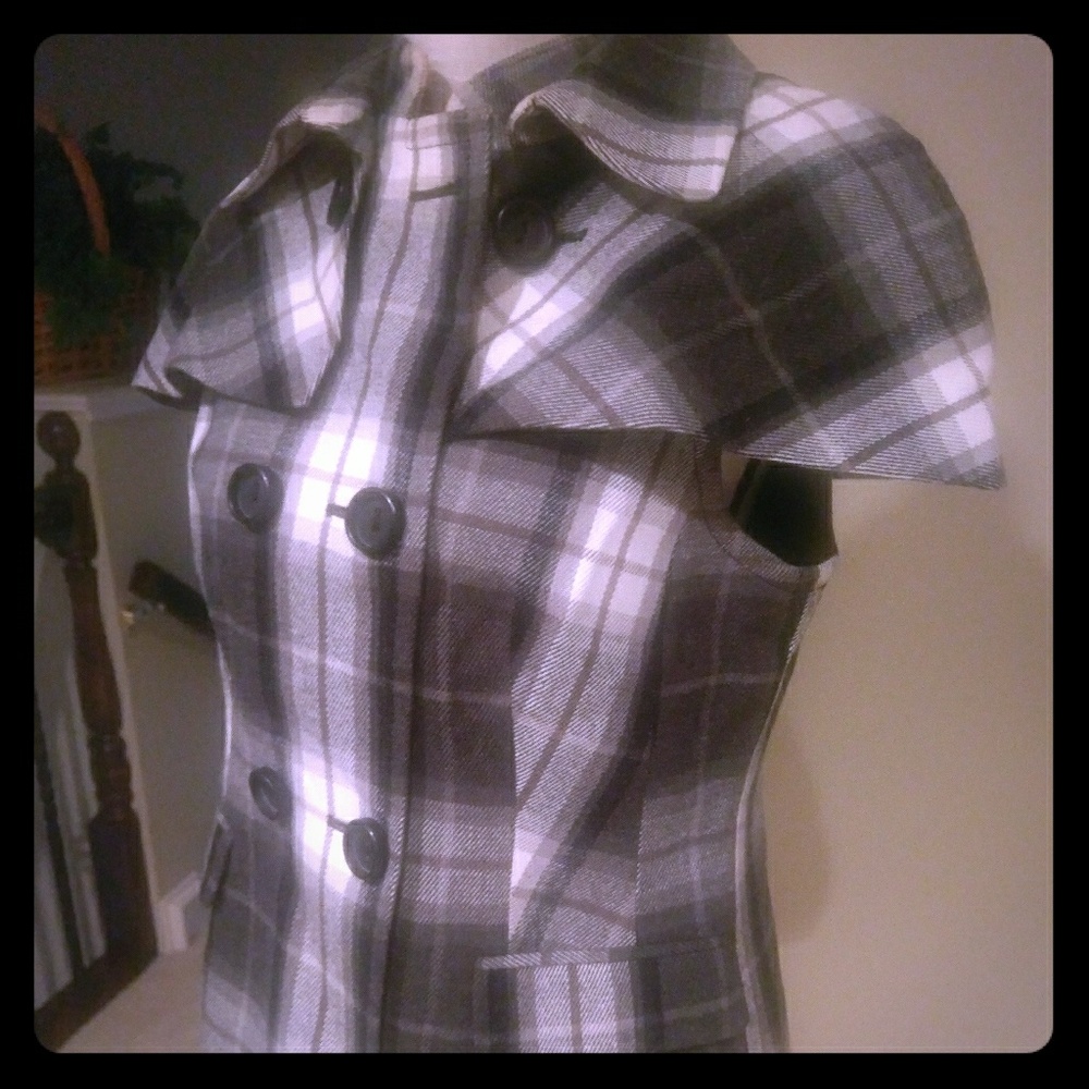Plaid vest with detachable cape.