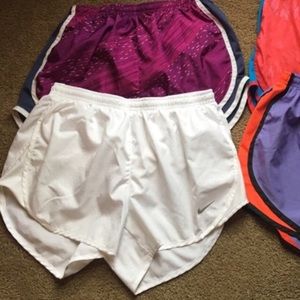 White Nike running shorts