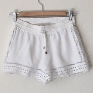Laced crochet drawstring white shorts.