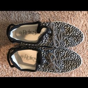 Black and white slip on sneakers