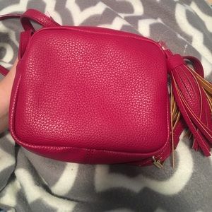 Maroon cross body bag with tassel