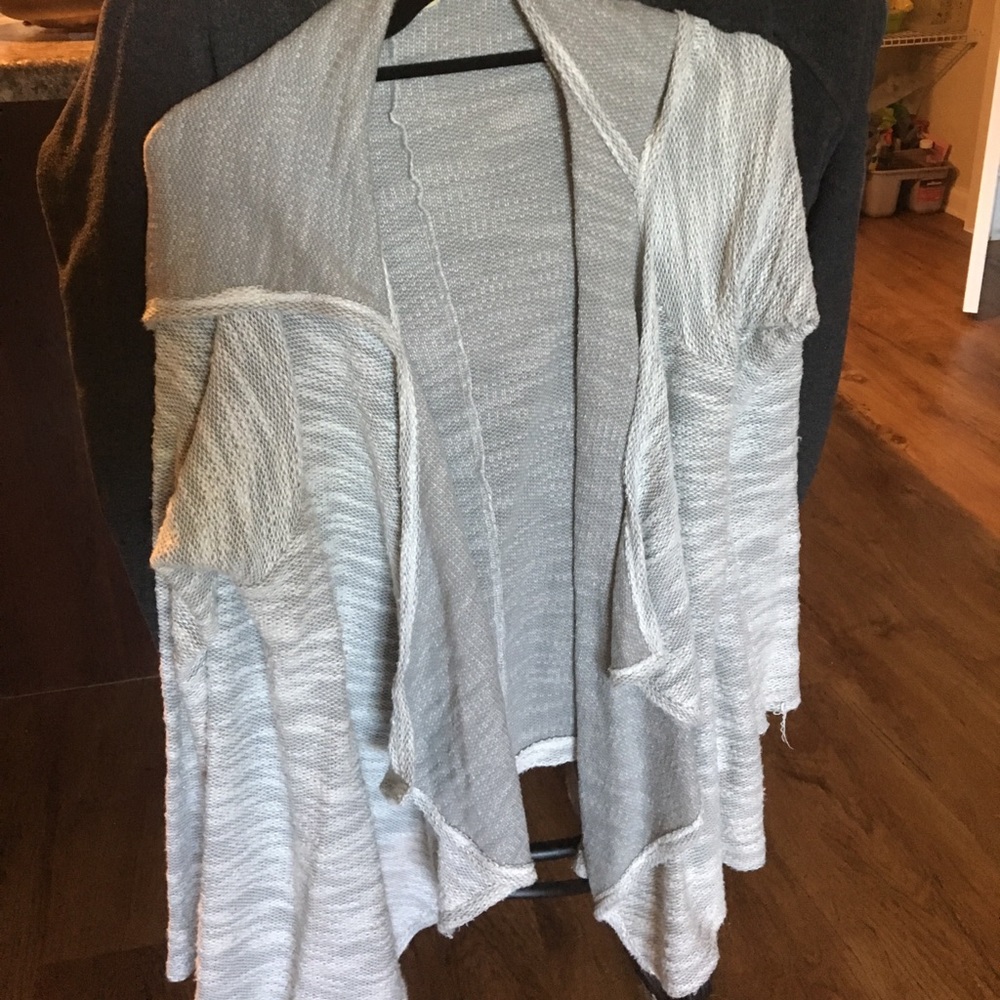 Grey sweater with a hood. Never worn