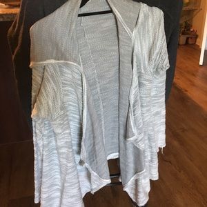 Grey sweater with a hood. Never worn