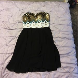 Strapless dress with a tribal sequin design.