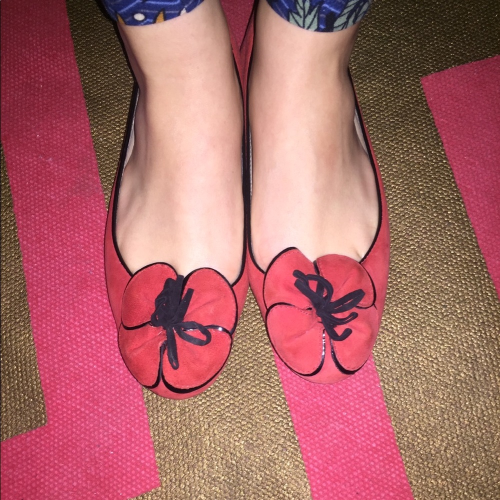 Red and black suede Kate Spade flats.