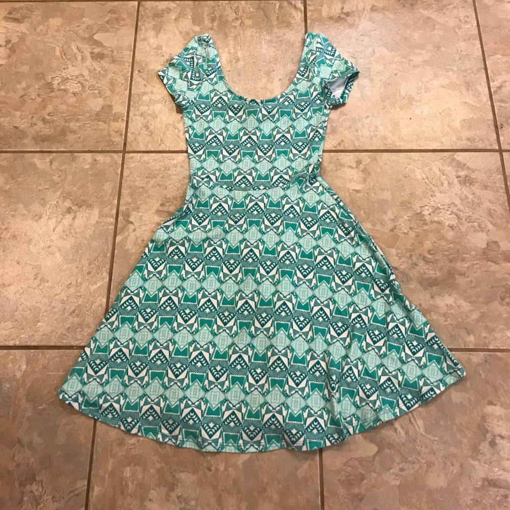 Green, real, and white Aztec print dress