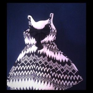 Beautiful black and white dress with frills at bac