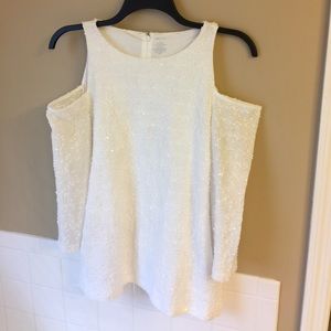 3/4 length, open shoulder shirt.