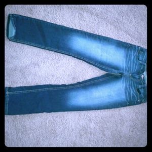 Women's distressed colored dark blue jeans
