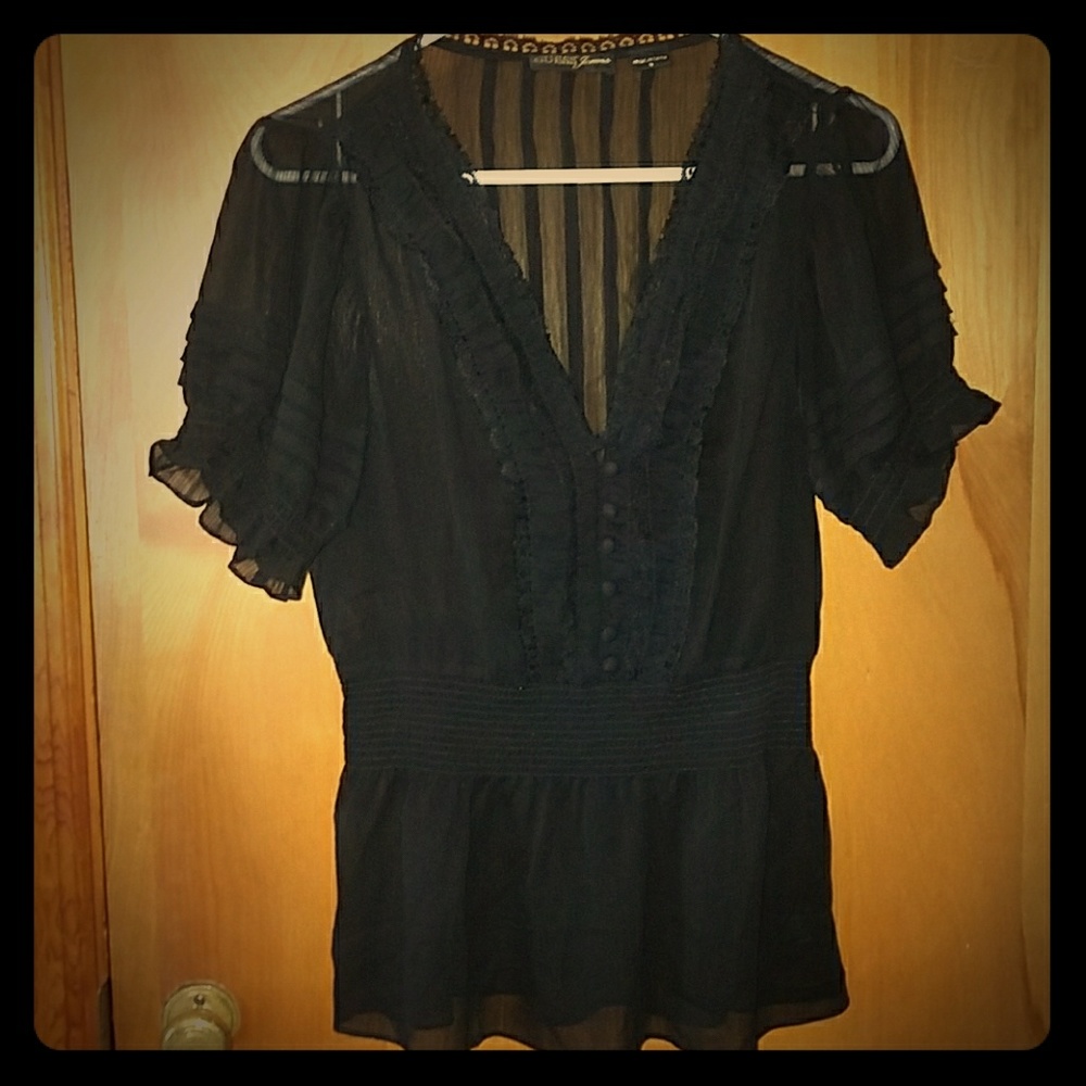 Black ruffled blouse.