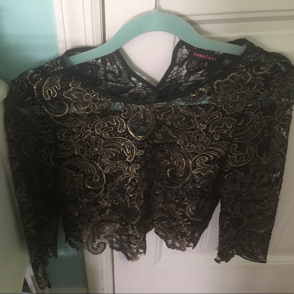 Gorgeous gold and black top. Size small