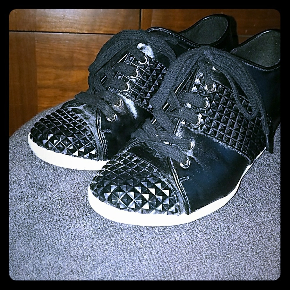 Black, lace up, wedged pumps.