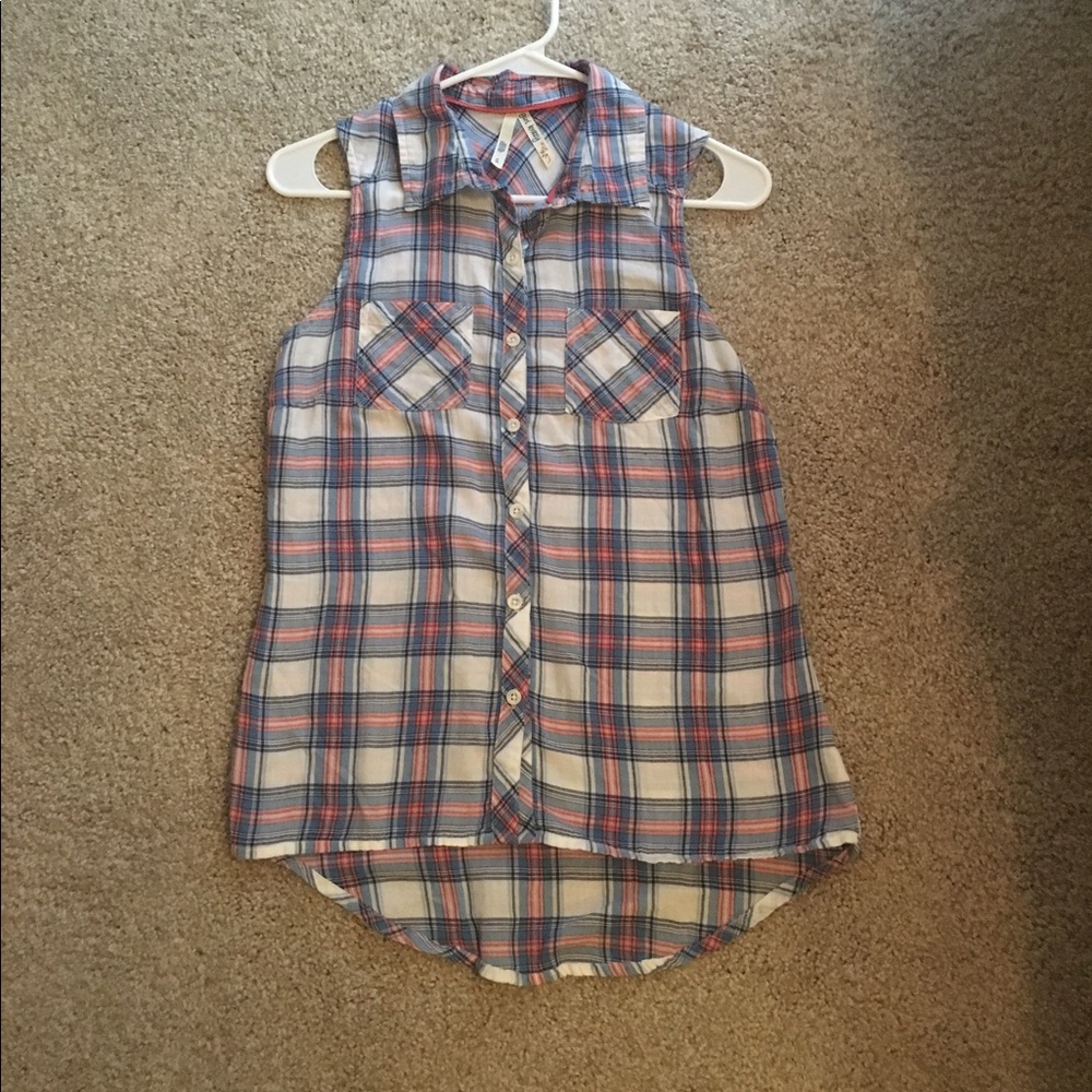 Sleeveless button down shirt.