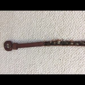 Thin brown waist belt with feathers