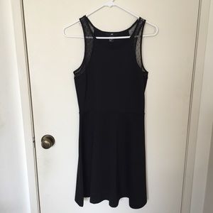 Black sleeveless dress with mesh detailing