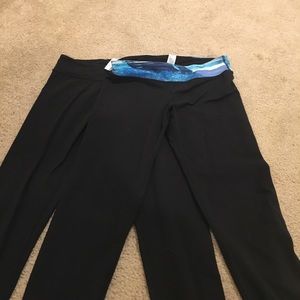 Two pairs of Ivivva rhythmic tights (leggings)