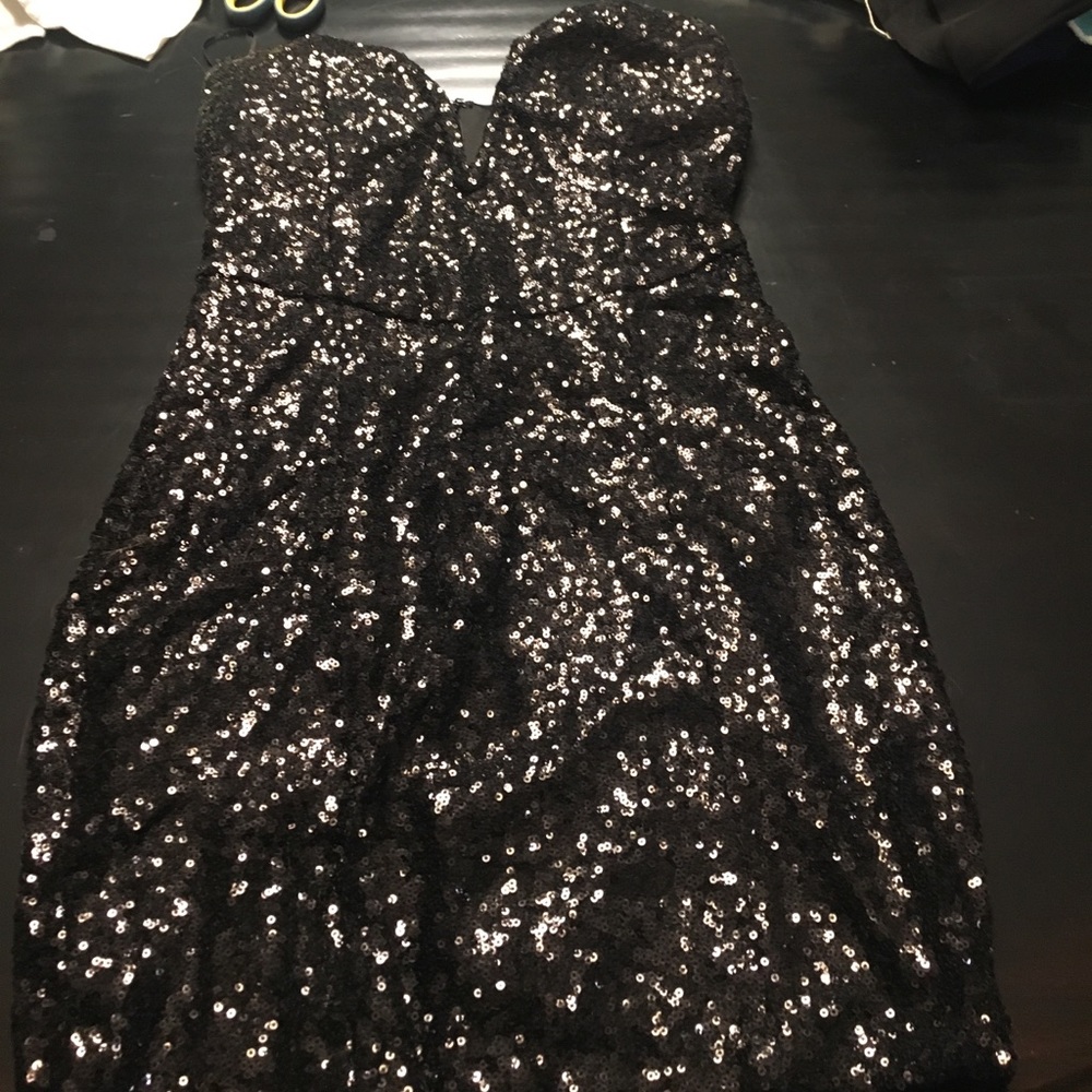 Tight black sequined dress
