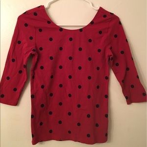 Red 3/4 sleeve shirt with black polka dots