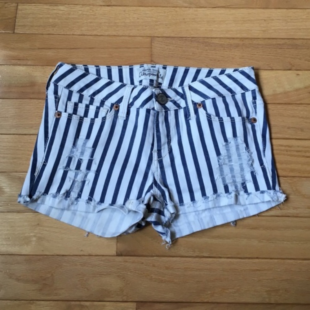 Distressed ultra skinny striped shorts