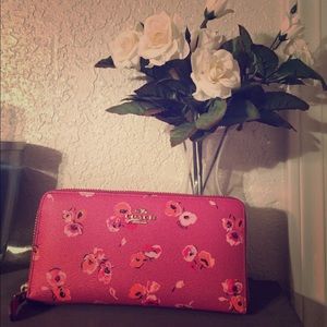 Zip around Coach wallet.