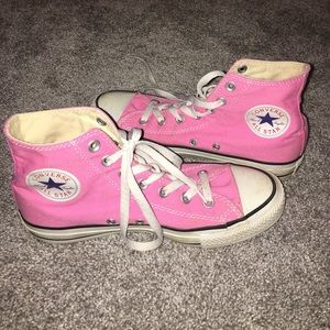 Bright pink hightop converse