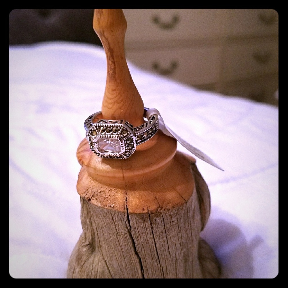 silver tone ring, clear middle stone