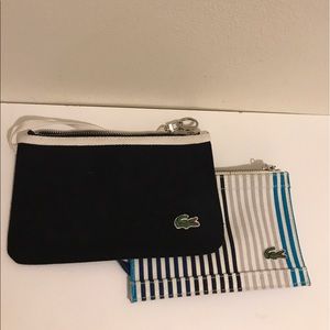 Two Lacoste wristlets