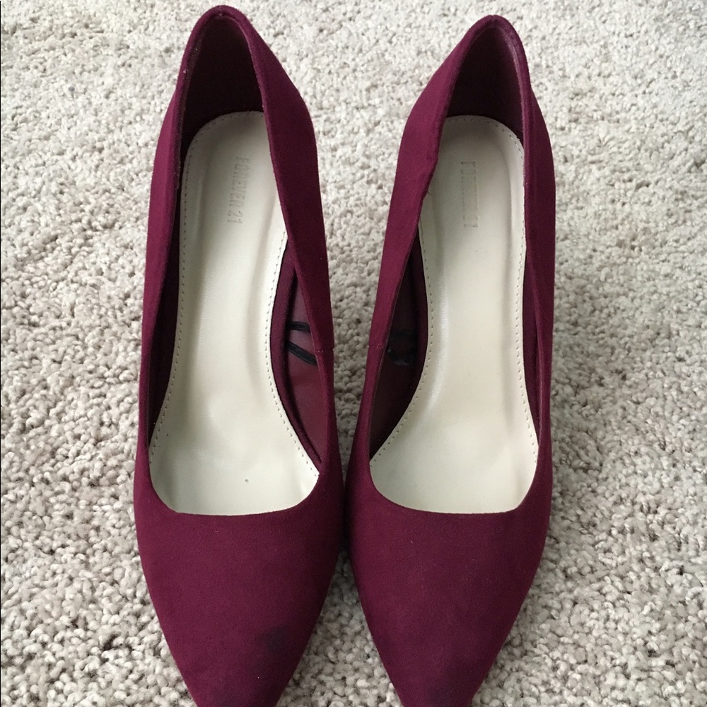 Red suede pumps