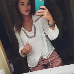white patterned flowy shirt