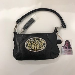 Black purse with interchangeable accents and chain