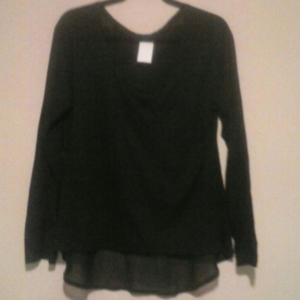 Black knit top with  with added sheer fabric