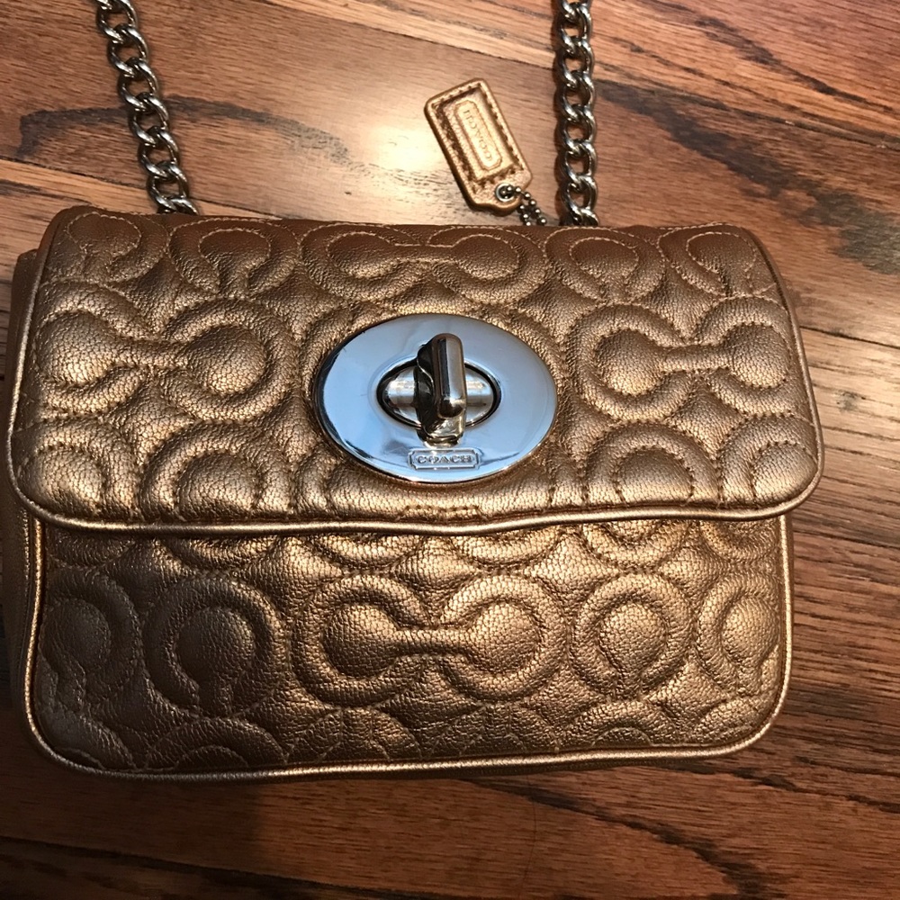 Small gold coach crossbody/ over the shoulder bag