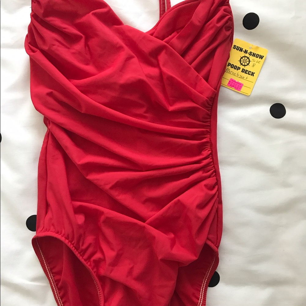 Brand new red magic suit with tag.
