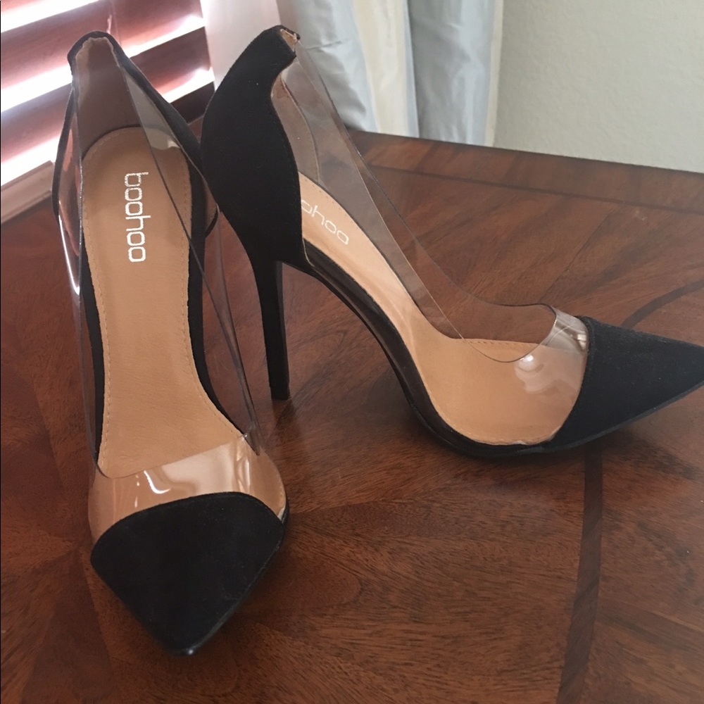 Clear plexi glass and black suede pump heel.
