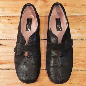 BeautiFeel black flats with rose detail.