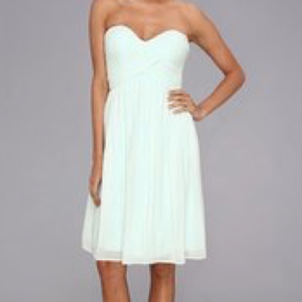 Mint green strapless Donna Morgan bridesmaid dress