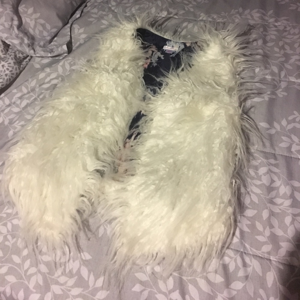 White fur vest