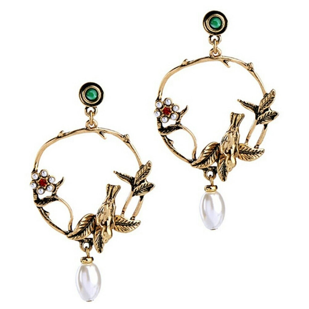 Bird gold dangle earrings
