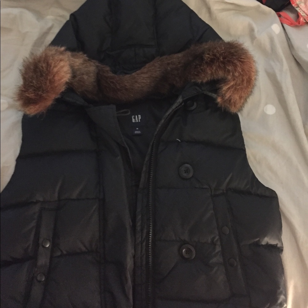 Black puffer vest with detachable fur on hood