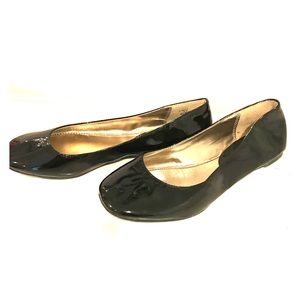 Black patten leather flats by Steve Madden