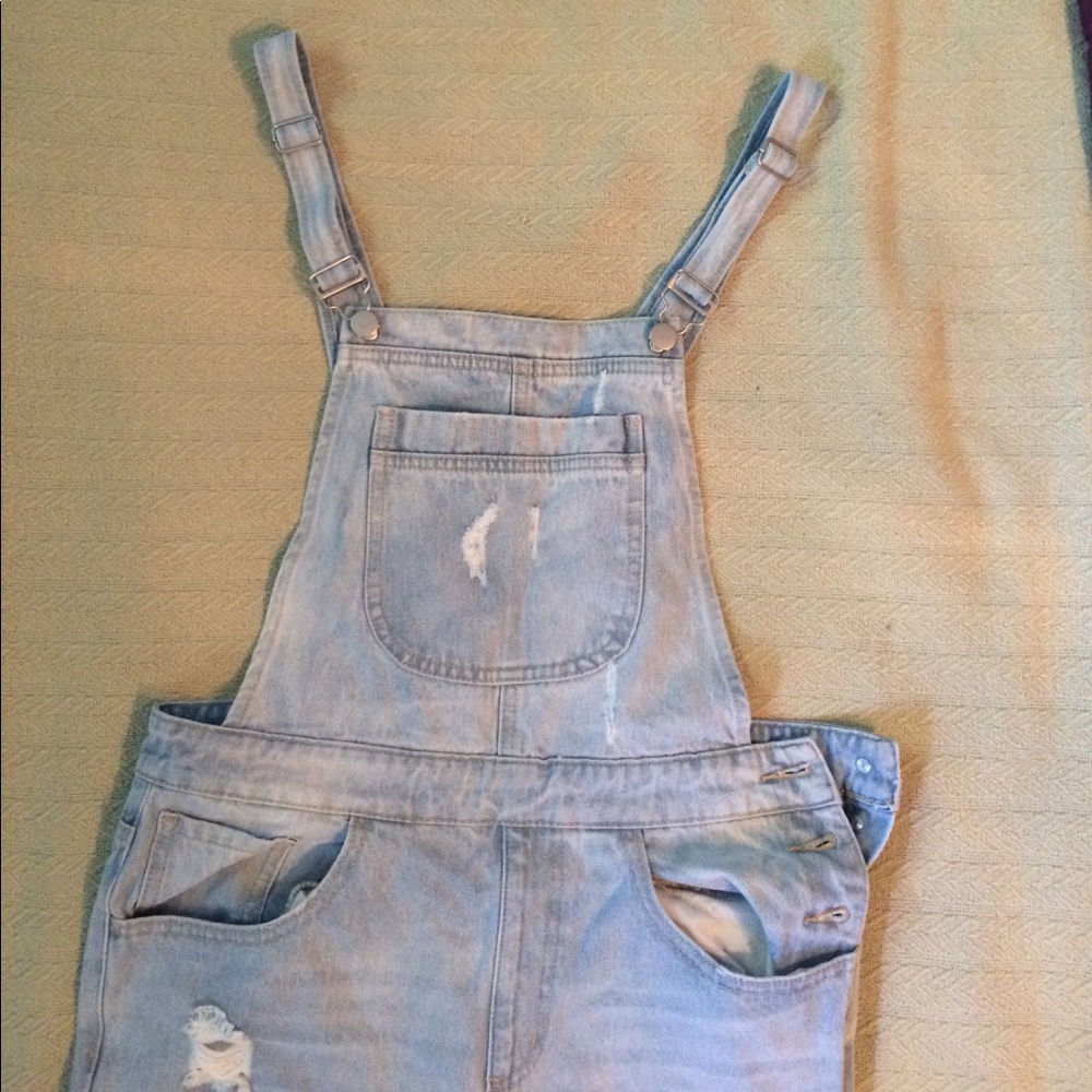 Light wash ripped denim overalls