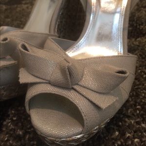 Wedge silver shimmer peep toe sandals.