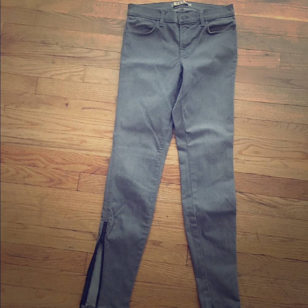 Dark gray skinny jeans. Never worn. ankle zippers
