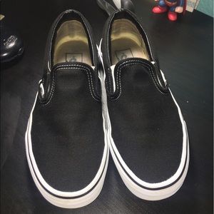 Black/white vans slip ons