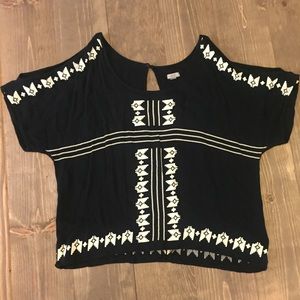 Black and patterned open shoulder top