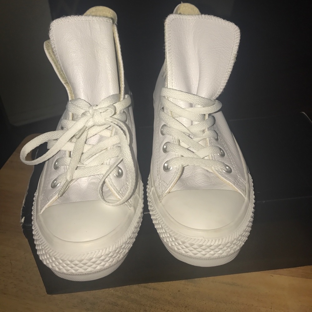 White leather Chuck Taylors high tops
